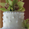 White Wedding Cake with Green Orchids